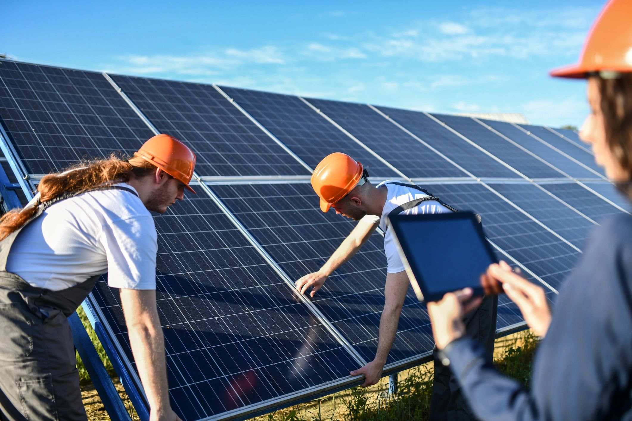 Supervisor briefing workers during a solar installation